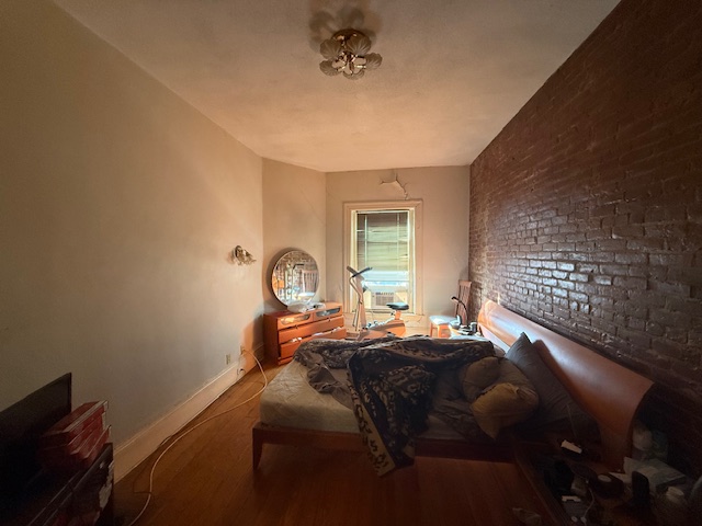 Before home staging of bedroom transformation in Brookline, MA real estate listing