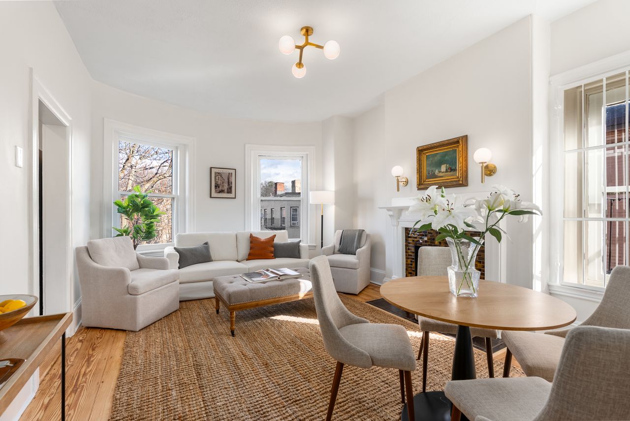 Before and after home and virtual staging of living room transformation in Brookline, MA real estate listing.
