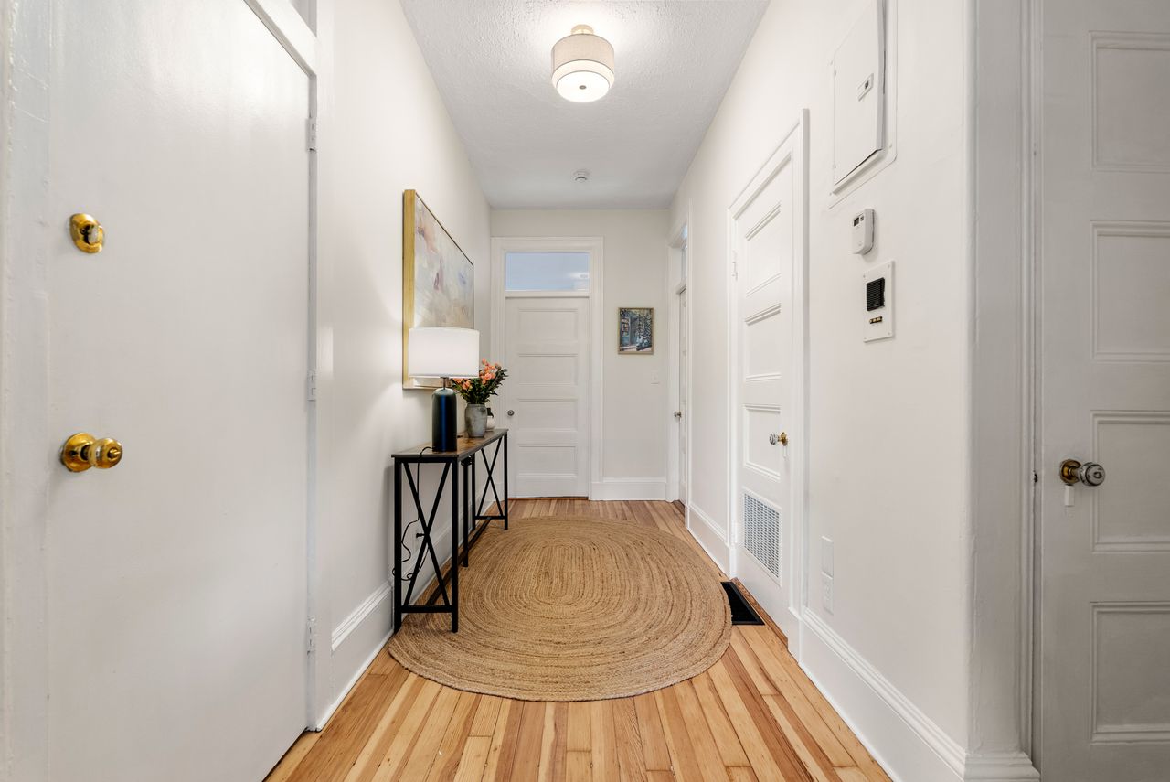 Before and after home and virtual staging of entry way transformation in Brookline, MA real estate listing.