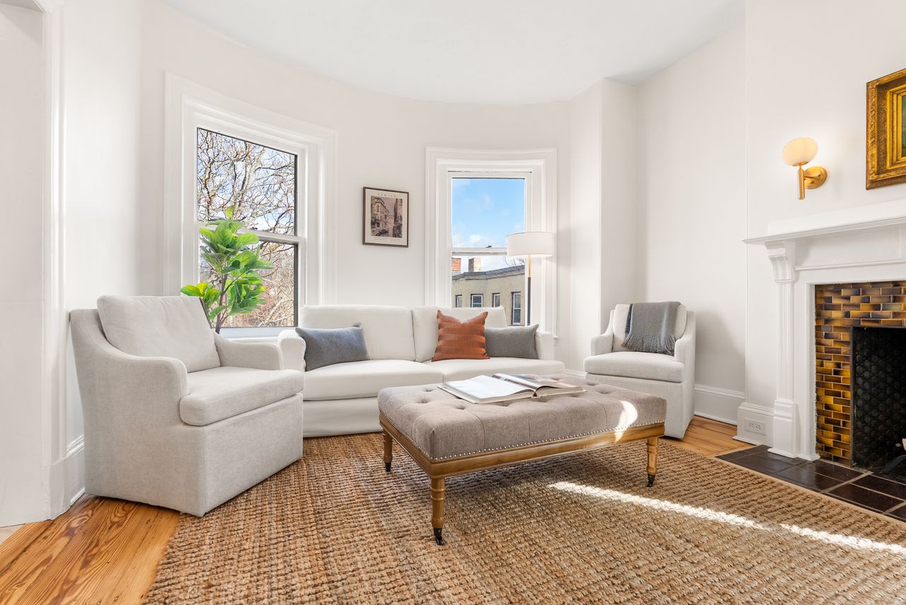 Before and after home and virtual staging of living room transformation in Brookline, MA real estate listing.
